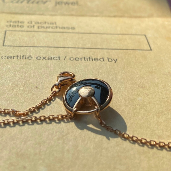 Ca*t*er amulet necklace